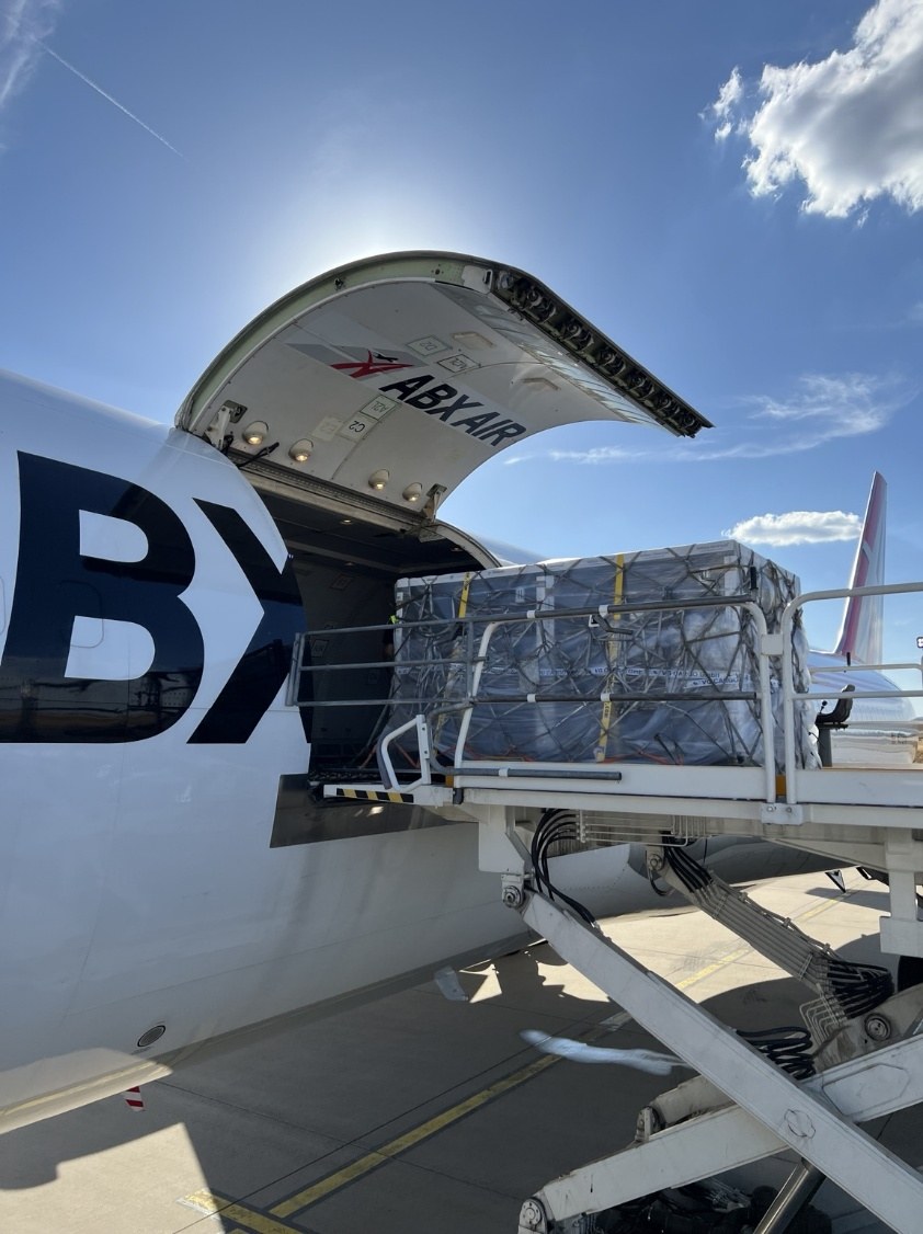 Temperature-controlled pallet shipper being loaded onto the chartered Boeing 767