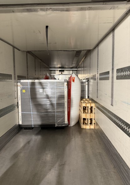 Temperature-controlled pallet shippers loaded for ground transportation to the airport