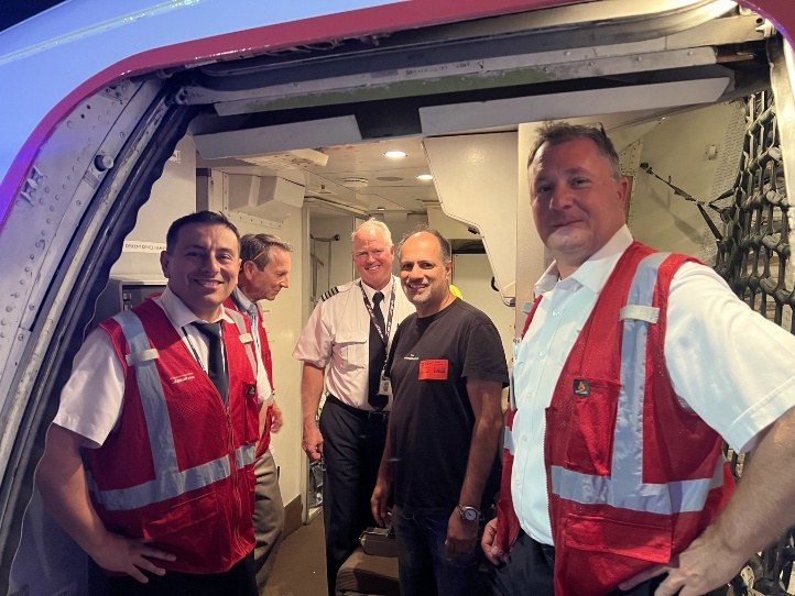 Teams coordinating the shipment around the aircraft